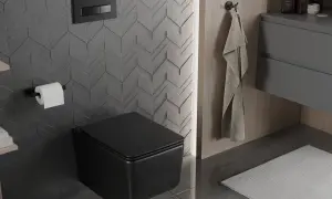 Nowoczesna łazienka z czarnym, podwieszanym WC. Zobacz, jak zamontować stelaż WC i cieszyć się minimalistycznym designem.