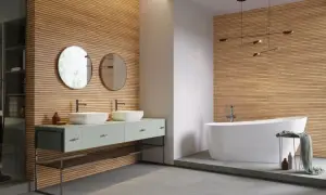 Nowe inspiracje: jakie lamele do łazienki? Drewniane panele tworzą ciepłą atmosferę, idealnie komponując się z nowoczesną wanną i podwójną umywalką.