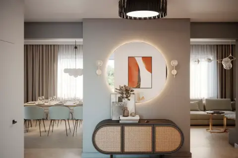 Nowoczesny przedpokój inspiracje ściany: okrągłe lustro z podświetleniem, rattanowa komoda i jadalnia w tle.