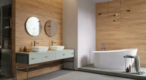 Nowe inspiracje: jakie lamele do łazienki? Drewniane panele tworzą ciepłą atmosferę, idealnie komponując się z nowoczesną wanną i podwójną umywalką.