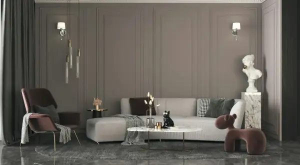 Nowoczesny salon w stylu eklektycznym: szara kanapa, bordowy fotel, marmurowy stolik i designerskie oświetlenie tworzą przytulną przestrzeń.
