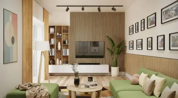 Nowoczesny salon z zieloną kanapą i inspiracjami na lamele ścienne. Drewniane lamele tworzą tło dla telewizora i półek.