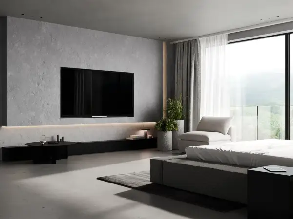 Nowoczesna ściana z TV w salonie, beton architektoniczny, minimalistyczne meble i widok na góry. Inspiracje dla Twojego wnętrza.