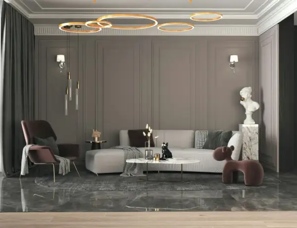 Nowoczesny salon w stylu eklektycznym: szara kanapa, bordowy fotel, marmurowy stolik i designerskie oświetlenie tworzą przytulną przestrzeń.